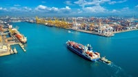 an aerial view of a port with a large number of ships