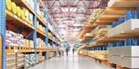 a warehouse with shelves full of pallets and boxes